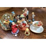 Various Walt Disney figures including a musical Mickey Mouse and friends snow globe, porcelain