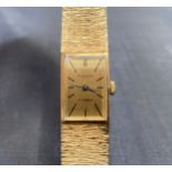 Addendum watch is 9ct gold not 18ct. An Accurist wristwatch, the dial of rectangular form with gol