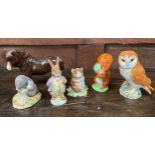 Four Beswick Pottery Beatrix Potter figures including 'Diggory Diggory Delvet' and 'Mr Benjamin