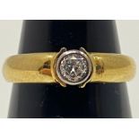 An 18ct yellow gold solitaire diamond ring, set with a round brilliant cut diamond, being H in