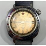 A vintage Russian Vostok Komandirskie stainless steel military issue wristwatch, the brown dial with