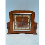 An early 20th century mahogany cased mantel clock with square dial, silvered chapter ring, Roman
