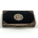 A late 19th/early 20th century silver-gilt and black enamel card/vanity box, the centre of lid