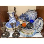 A mixed lot including a pair of bronze candlesticks, Chinese blue and white vase, oriental plates,