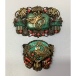 Two 1930s gilt metal Chinese style brooches probably by Max Neiger (brothers), one with central faux