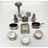 A small collection of assorted silver items comprising a cased cruet set comprising mustard and
