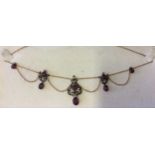 An Edwardian ruby and diamond necklace, comprising five round faceted and three oval faceted natural