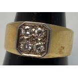 An 18ct yellow gold signet ring, set with four round brilliant cut diamonds to a square shaped