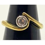 An 18ct yellow gold solitaire diamond ring, the round brilliant cut diamond being J in colour, SI1