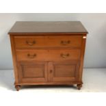 An early 20th century French walnut chest of two drawers above a pair of cupboard doors, 92cm