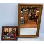 A rectangular wall mirror with gilt-wood frame, together with a smaller oak framed mirror with