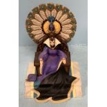 A Walt Disney Classics Collection Snow White Villains porcelain figure of the Wicked Queen sat on