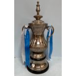 A large white metal replica of the FA Cup trophy, 71cm high