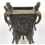 A Chinese patinated bronze censor of tapering pentagonal form, cast with five dragon handles (two