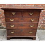 An 18th Century oak chest of two short and three long graduated drawers, with replacement brass
