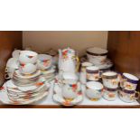 A Carlton China tea and coffee service decorated with flowers to a white ground, comprising coffee