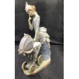 A Lladro figure 'Baby's First Outing', designed by Salvador Debon, model number 4938, in original