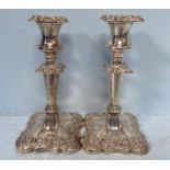 A pair of loaded silver candlesticks by I S Greenberg, with hallmarked, removable sconces and