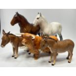 Five assorted Beswick pottery animals comprising a dapple grey Shire horse and another shire