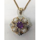 A 9ct gold pendant, set with a round faceted amethyst to the centre, with four pearls surrounding,