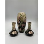 A Moorcroft pottery vase decorated with lavender and yellow flowers to ivory and black ground, of