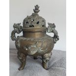 A Chinese copper alloy censor, cast and chased with elephant finial to the pierced dome cover,