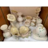 A collection of assorted Belleek pottery wares comprising a honey pot modelled as a bee-hive,