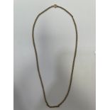 A 9ct yellow gold chain, measuring 18 inches in length, weighing 6.8 grams.