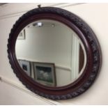 Three various wooden framed, bevelled mirrors, the largest oval examples measures 90cm long