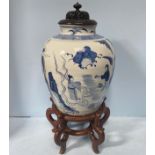 A large Chinese porcelain vase of ovoid form, decorated in underglaze blue with figures making