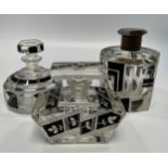 Three various Art Deco glass perfume bottles all with black geometric designs, the tallest 13cm (two