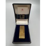 A Dunhill gold-plated lighter, with directions booklet, in original box.
