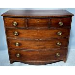 A George III inlaid mahogany bow-fronted chest of three short, over three long graduated drawers,