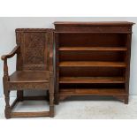 A 19th century Jacobean style oak carved chair, with carved back, raised on turned supports with