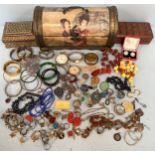 A large quantity of costume and silver jewellery including necklaces, amber coloured beads,