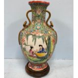 A Chinese porcelain vase of baluster form and lotus section, incised and decorated in polychrome