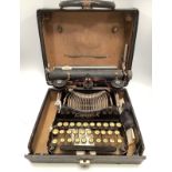 A vintage Corona typewriter, in black hard case