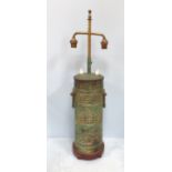 A Chinese patinated bronze vase converted to an adjustable lamp, decorated with various symbols