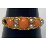 A gold, coral and pearl ring (lacking one pearl), tests as 18ct, 3.2g ring size N/O