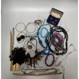 A small quantity of costume jewellery including necklaces, earrings, brooches and cufflinks,