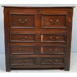 An 18th century and later oak mule/chest of drawers, the top with removable panel enclosing storage,