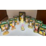 A set of eight Royal Doulton Walt Disney figures, Snow White and the Seven Dwarves, Sleepy, Dopey,