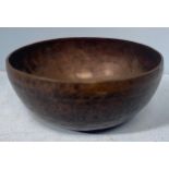A large Tibetan bronze singing bowl engraved inside and out with eye of buddha to base, believed