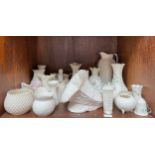 A collection of approximately 32-pieces of Belleek porcelain, comprising a Millennium 2000 shell,