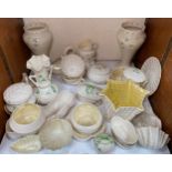 A good collection of assorted Belleek pottery items including vases, cups and saucers, lidded pots