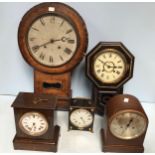 A drop-dial wall clock together with four other various clocks including a W&H Sch German mantel