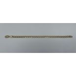A 9ct solid yellow gold flat curb link bracelet, weighing 15.2 grams, measuring approximately 8.5