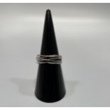 An 18ct white gold dress ring, set with small diamonds over six thin wire bands, total weight of