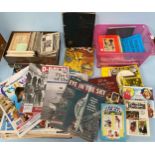 A mixed lot of collectables including postcards, saucy postcard and postcard collectors books,