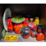 A collection of 23 assorted items of Poole pottery, comprising ginger jars, vases, chargers and